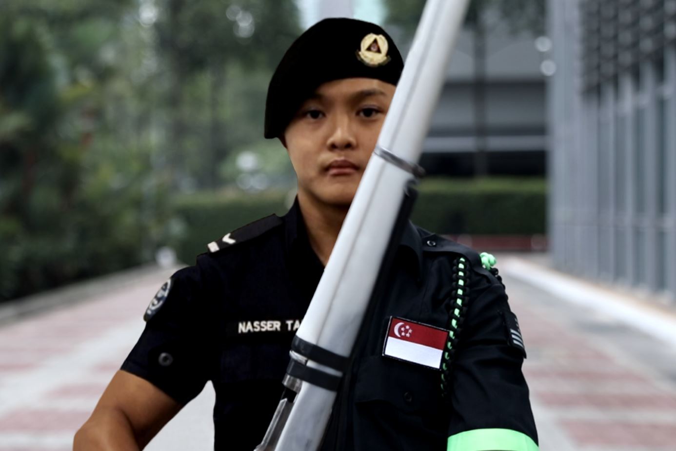 Nasser in his SCDF uniform (left segment) and uniform for Precision Drill competitions (right segment)